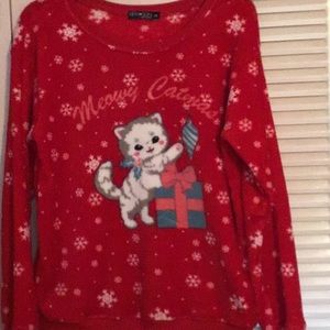 Cat themed sweater says “Meowy Catmas”